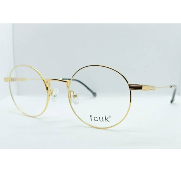 Gold round frame by Fcuk